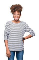Beautiful young african american woman wearing glasses over isolated background winking looking at...