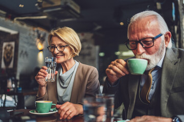Mature Woman and Senior Man couple Bond Over Coffee at Cafe sit talk