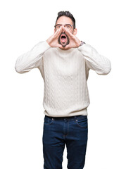 Fototapeta premium Young handsome man wearing glasses over isolated background Shouting angry out loud with hands over mouth