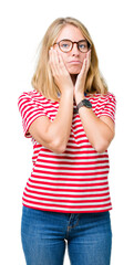 Beautiful young woman wearing glasses over isolated background Tired hands covering face, depression and sadness, upset and irritated for problem