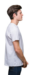 Young handsome man wearing casual white t-shirt over isolated background looking to side, relax profile pose with natural face with confident smile.