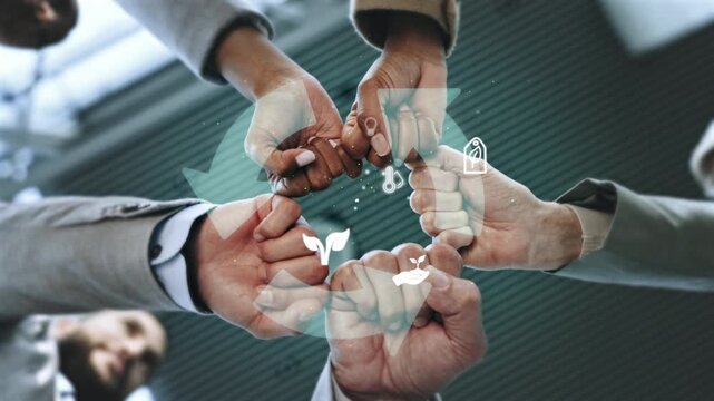 Below, business people and fist bump for team building, collaboration in renewable energy or infrastructure. Group of environmentalist, sustainability and social responsibility partnership in synergy