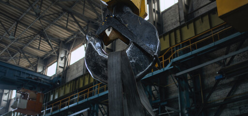 Professional industrial equipment for transporting products and heavy loads. Big production crane moving at manufacturing factory, plant or warehouse. Concept of heavy industry technologies.