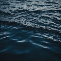 Fototapeta premium The still surface of a lake reflecting the bright colors of autumn leaves and the soft light of the setting sun