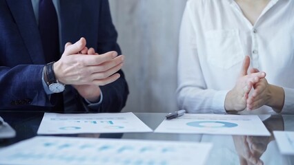 Business team wearing suits clapping hands after successful presentation. Businesspeople diverse group