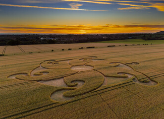 Aerial view of an intricate geometric crop circle formation in a wheat field near Etchilhampton and Devizes in Wiltshire, England, UK