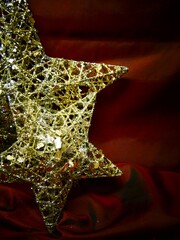 Golden Christmas Stars on a dark red Background 