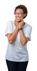 Beautiful young african american woman wearing glasses over isolated background Smiling with open mouth, fingers pointing and forcing cheerful smile