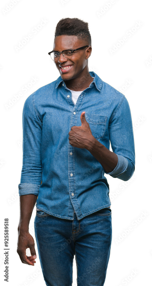 Poster Young african american man over isolated background doing happy thumbs up gesture with hand. Approving expression looking at the camera with showing success.