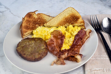 scramble eggs  with bacon and sausage patty