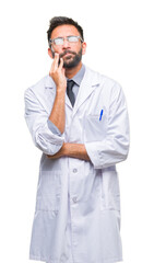 Adult hispanic scientist or doctor man wearing white coat over isolated background thinking looking tired and bored with depression problems with crossed arms.