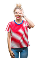 Young beautiful blonde woman wearing glasses over isolated background doing ok gesture with hand smiling, eye looking through fingers with happy face.