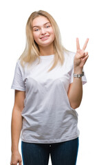 Young caucasian woman over isolated background showing and pointing up with fingers number two while smiling confident and happy.