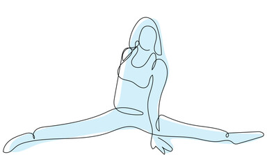 A girl performs a split, showcasing flexibility and balance in a peaceful outdoor setting at dawn.