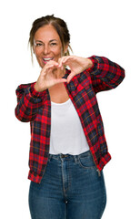 Middle age adult woman wearing casual jacket over isolated background smiling in love showing heart symbol and shape with hands. Romantic concept.