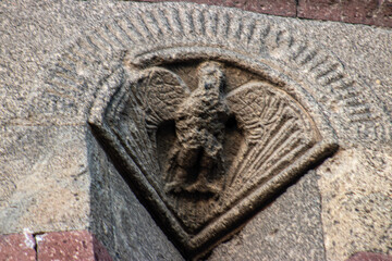 Ornate eagle carvings on the Emir Saltuk Tomb in Erzurum, symbolizing power, freedom, and protection in Turkish mythology and medieval architecture.