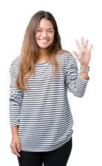 Young beautiful brunette woman wearing stripes sweater over isolated background showing and pointing up with fingers number five while smiling confident and happy.