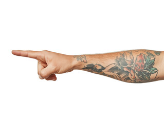 A hand with a vibrant tattoo points outward, emphasizing the arm's intricate designs and clear intent. Isolated on transparent background.