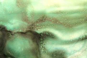 abstract art background of streaks in green tones