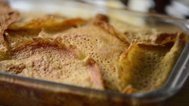 Close-up video pan of Timballo: layers of crepes, artichokes, meat, cheese, B&eacute;chamel sauce, from Abruzzo, Italy.