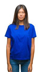 Fototapeta premium Young asian woman over isolated background with serious expression on face. Simple and natural looking at the camera.