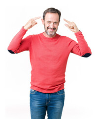 Fototapeta premium Handsome middle age hoary senior man wearing winter sweater over isolated background Smiling pointing to head with both hands finger, great idea or thought, good memory