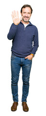 Obraz premium Middle age handsome man wearing a sweater showing and pointing up with fingers number five while smiling confident and happy.