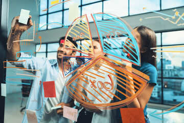 Skilled project manager pointing at glass wall while coworker thinking about plan. Diverse business team working together, brainstorming marketing idea or business plan. Creative start up. Tracery.