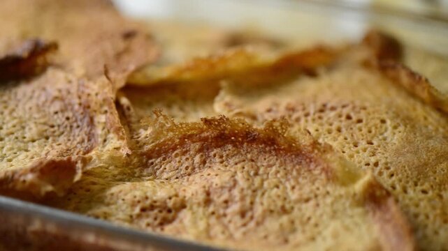 Close-up video pan of Timballo: layers of crepes, artichokes, meat, cheese, B&eacute;chamel sauce, from Abruzzo, Italy.