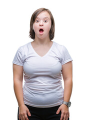Fototapeta premium Young adult woman with down syndrome over isolated background afraid and shocked with surprise expression, fear and excited face.