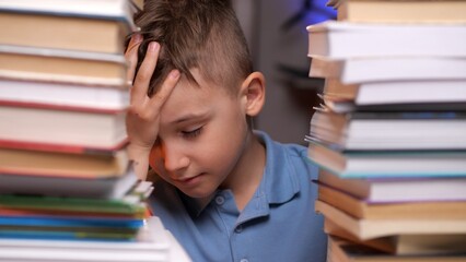 Young student feeling exhausted and stressed while studying