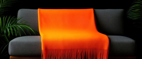 Orange Blanket On A Grey Sofa In A Modern Apartment Interior With A Poster And Wooden Accents