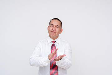 Amused and smug middle aged asian business man clapping his hands while smirking acknowledging the...