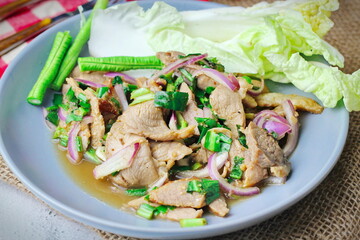 Sliced grilled beef salad, Isaan food in Thailand, local food in Thailand.