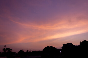 Beautiful sunset sky with clouds in the evening. Nature background.