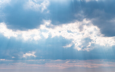 Obraz premium Cloudy fluffy sky natural background. Blue and white cloudscape. Transition of gently cloud scape at summer day. Clean of birds, bugs, and dust.