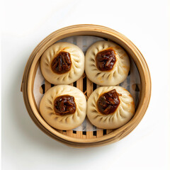 a wooden basket filled with dumplings and sauce