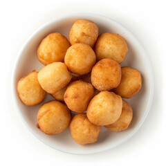 a bowl of donuts on a white surface