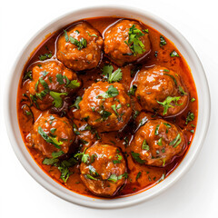a bowl of meatballs with sauce and garnish