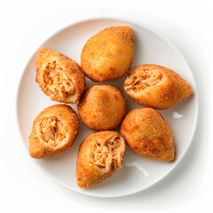 a plate of fried food on a white table