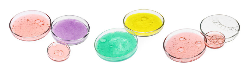 Set of Petri dishes with liquid samples on white background
