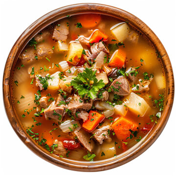 a bowl of soup with meat  vegetables and herbs