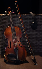 Fototapeta premium violin is recording studio on a chair - close up