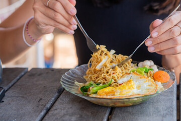 Enjoying Noodles with Fried Egg