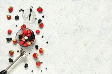Hand blender and different berries for preparing fresh smoothie on white background