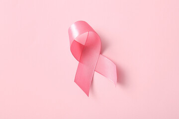 Pink ribbon on color background. Breast cancer awareness concept