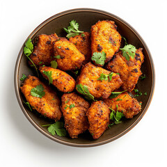 Fototapeta premium a bowl of fried chicken with parsley