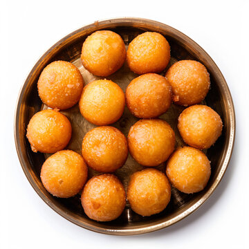 a bowl of doughnuts on a white surface