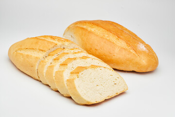 Freshly baked white bread loaf, sliced and ready to serve, perfect for sandwiches and breakfast