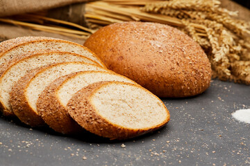 Whole wheat bread loaf sliced, showcasing its hearty texture and rich, wholesome flavor